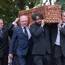 Family and friends follow the wicker coffin of playwright Brian Friel at his home in Greencastle, Co Donegal. Pic: Martin McKeown.